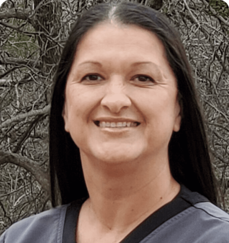 Woman with dark hair and natural setting