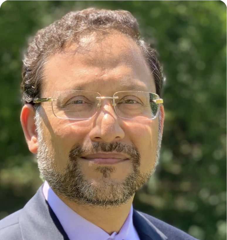 Bearded man wearing glasses in sunlight